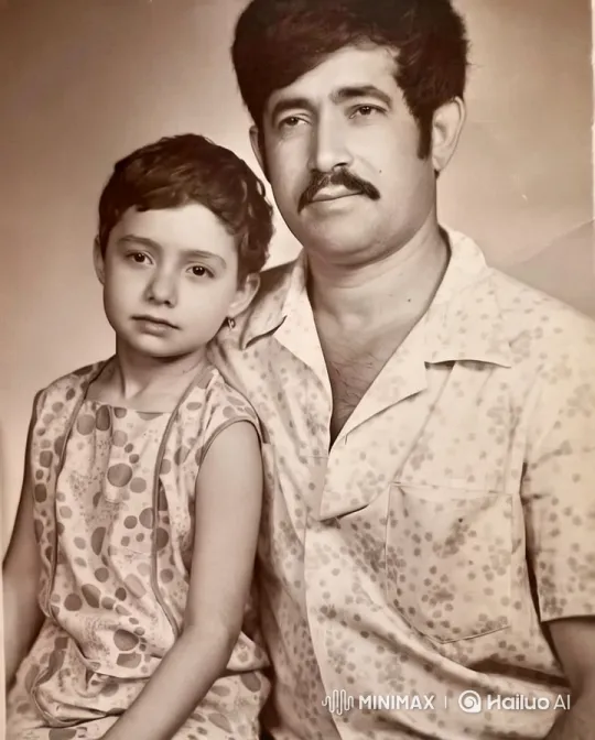 Intimate Father-Daughter Moment in Patterned Clothing – AI Generated Video | Hailuo AI