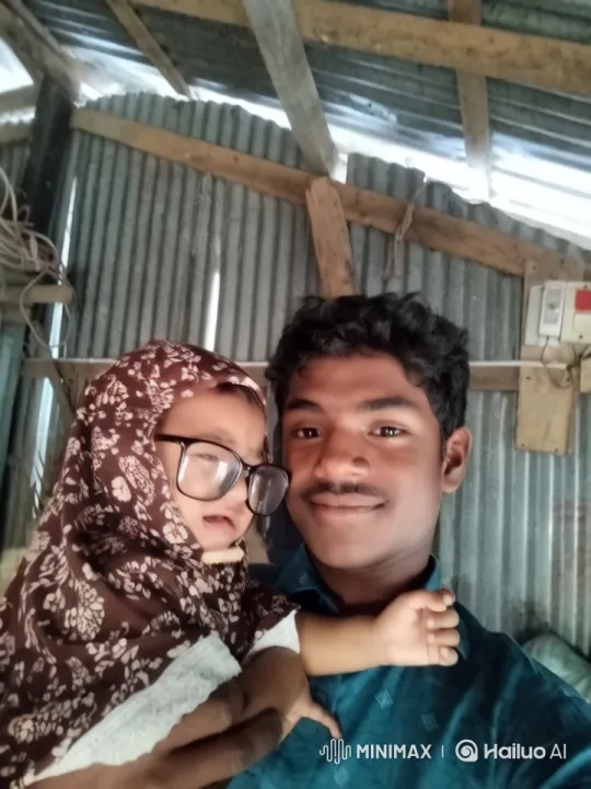 Man and Baby in Traditional Attire: A Rustic Setting – AI Generated Video | Hailuo AI