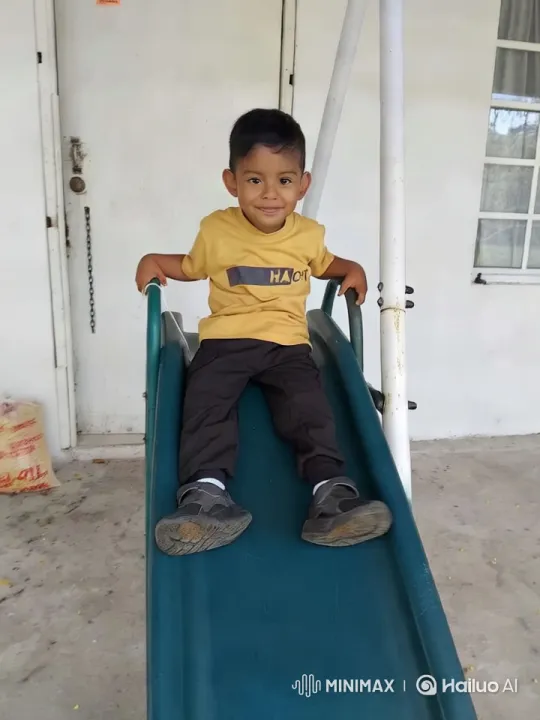Boy's Joyful Dance on Green Slide – AI Generated Video | Hailuo AI