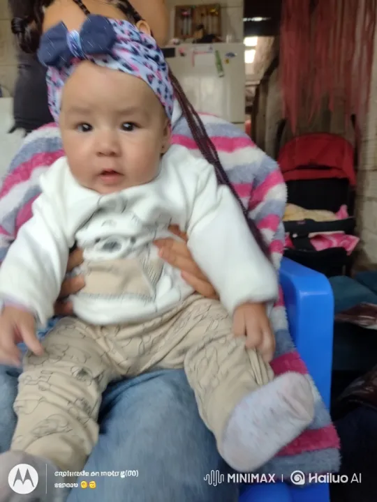 Baby Dancing on Adult's Lap in Cozy Outfit – AI Generated Video | Hailuo AI