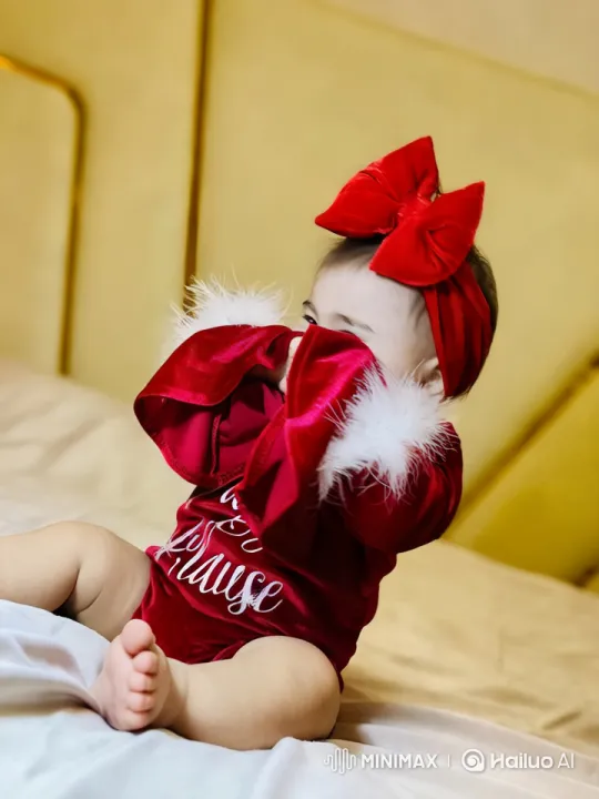 Baby in Festive Outfit Plays with Sleeves – AI Generated Video | Hailuo AI