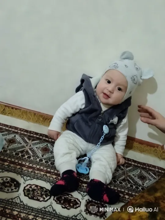 Baby in Aesthetic Clothing on Patterned Carpet – AI Generated Video | Hailuo AI