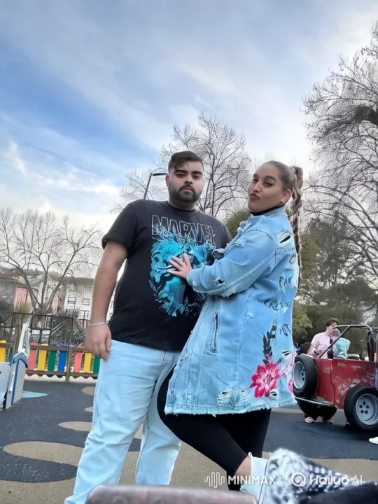 Couple's Intimate Moment in Colorful Park Setting – AI Generated Video | Hailuo AI