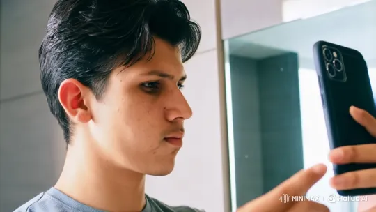Young Man Reflects on His Appearance in Modern Bathroom – AI Generated Video | Hailuo AI