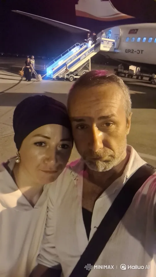 Nighttime Airport Selfie with Illuminated Airplane Stairs – AI Generated Video | Hailuo AI