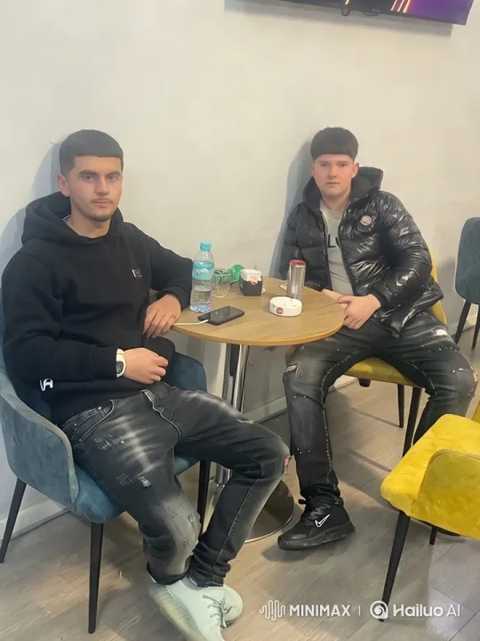 Intimate Moment Between Two Men in Modern Café – AI Generated Video | Hailuo AI