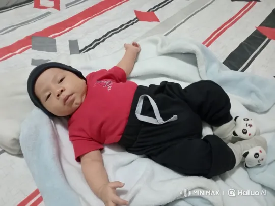 Baby Dancing Joyfully on Patterned Bed – AI Generated Video | Hailuo AI