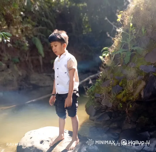 Boy Imagines Flying as Superman in Serene Stream – AI Generated Video | Hailuo AI