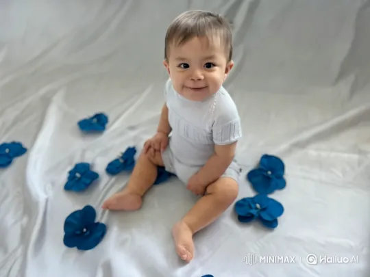 Baby Dancing Joyfully Amongst Blue Flowers – AI Generated Video | Hailuo AI