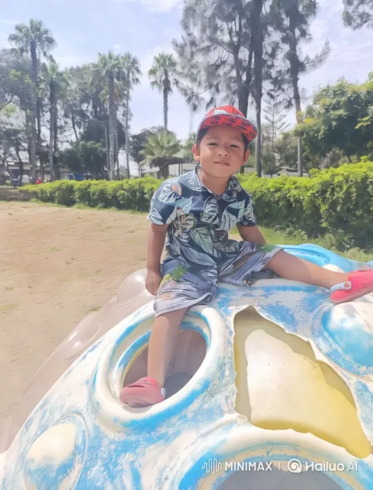 Boy Dances Joyfully on Play Structure in Colorful Park – AI Generated Video | Hailuo AI
