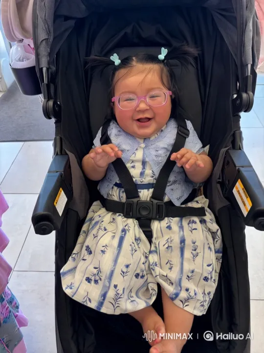 Toddler in Floral Dress Dancing in Stroller – AI Generated Video | Hailuo AI