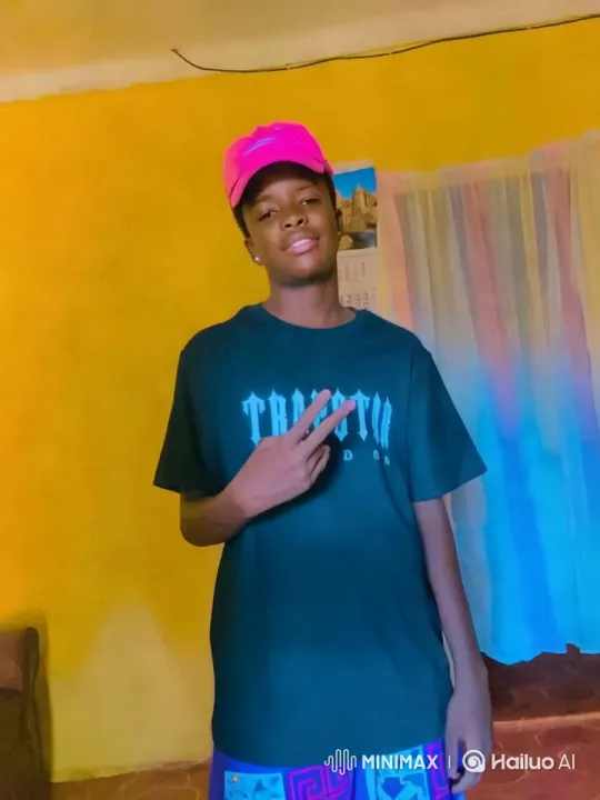 Young Man in Bright Room Poses with Peace Sign – AI Generated Video | Hailuo AI