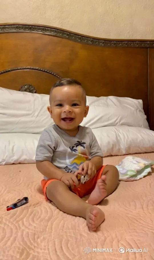 Baby Dancing Joyfully on Peach-Colored Bedspread – AI Generated Video | Hailuo AI