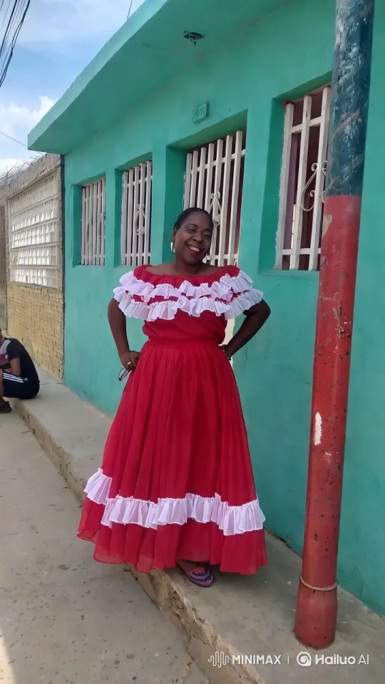 Woman in Red Dress Dances Gracefully in Front of Colorful Building – AI Generated Video | Hailuo AI