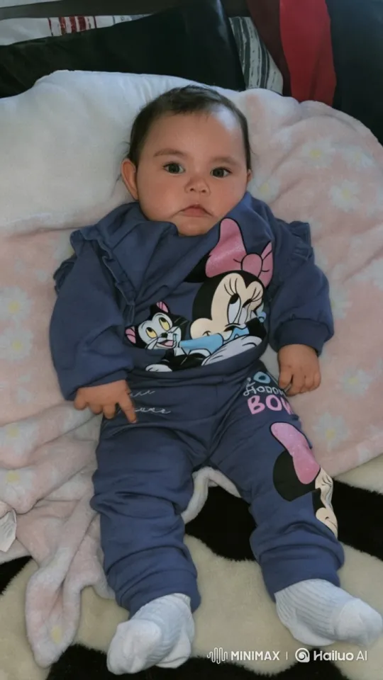 Baby in Minnie Outfit Dances Cozily on Soft Blanket – AI Generated Video | Hailuo AI