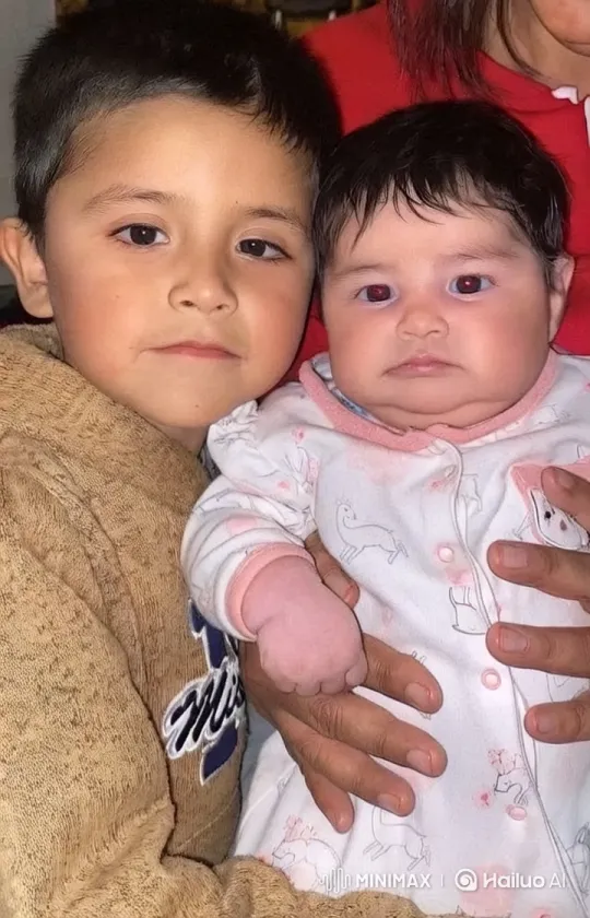 Child and Baby Bond in Cozy Indoor Setting – AI Generated Video | Hailuo AI
