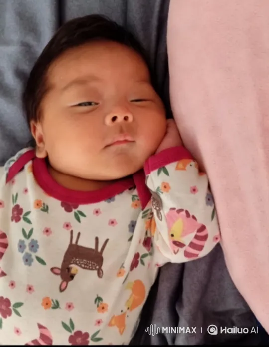 Cozy Moments: Baby Rests in Colorful Onesie – AI Generated Video | Hailuo AI