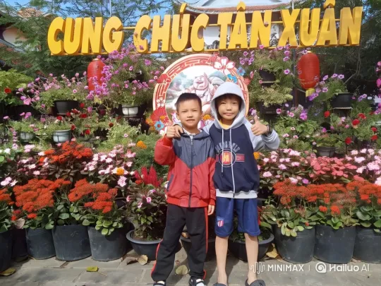 Children Celebrate New Year with Floral Backdrop – AI Generated Video | Hailuo AI