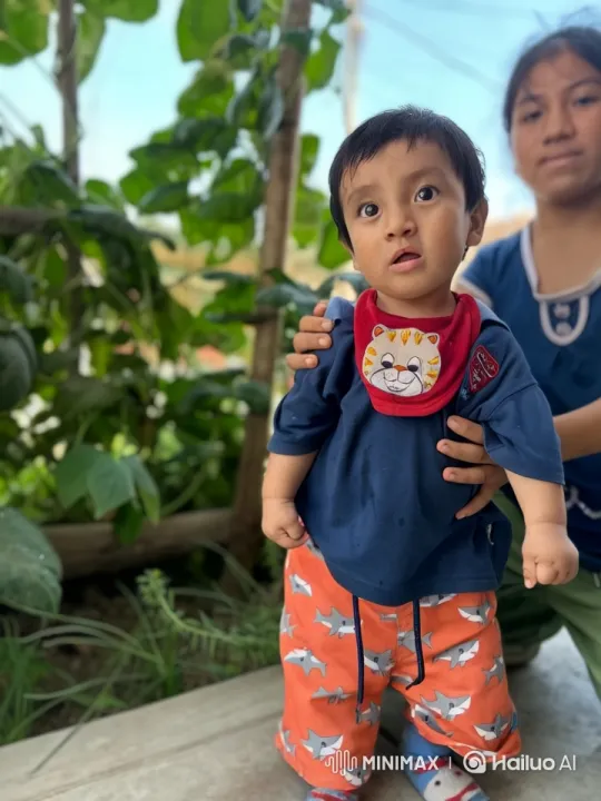 Child in Playful Kung Fu Pose in Lush Outdoor Setting – AI Generated Video | Hailuo AI
