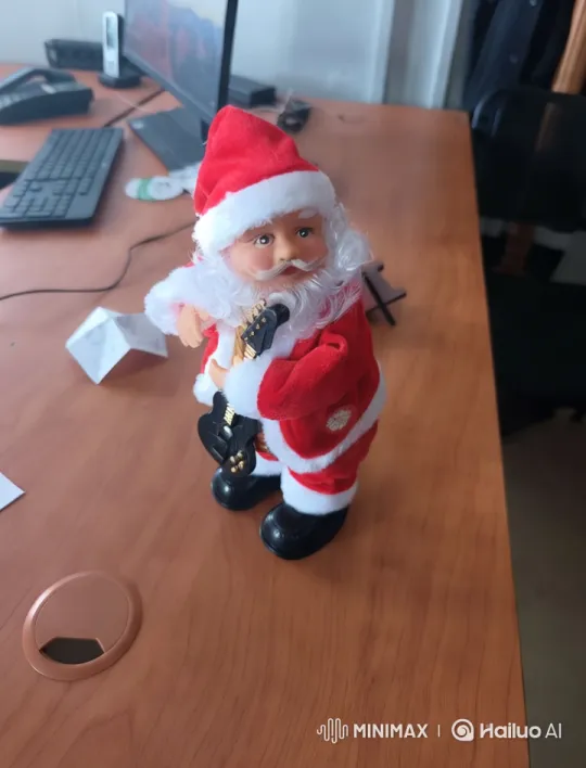 Santa Claus Doll Dancing on Desk – AI Generated Video | Hailuo AI