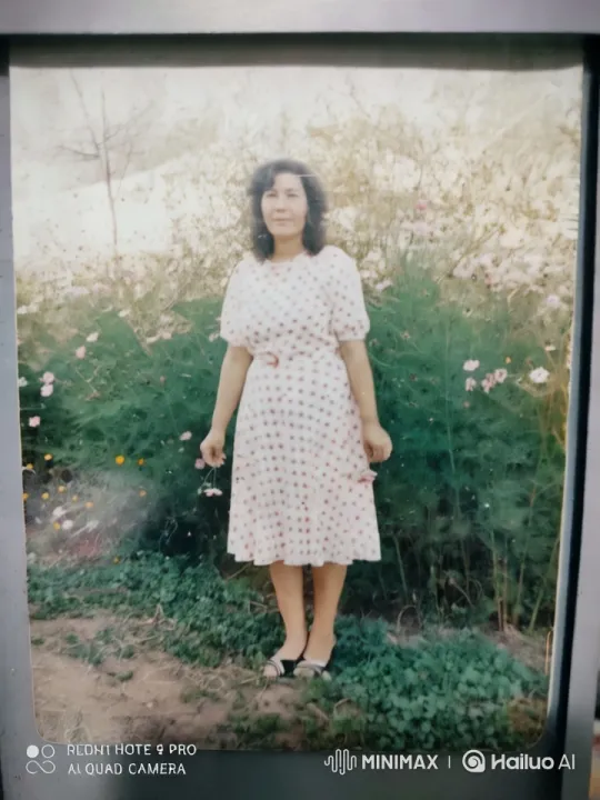 Woman in Polka Dot Dress in Serene Flower Garden – AI Generated Video | Hailuo AI