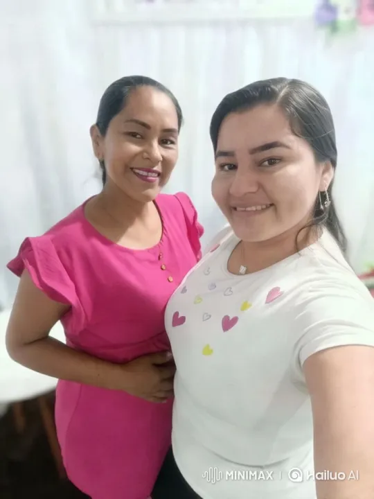 Two Women in Colorful Dresses in Elegant Setting – AI Generated Video | Hailuo AI