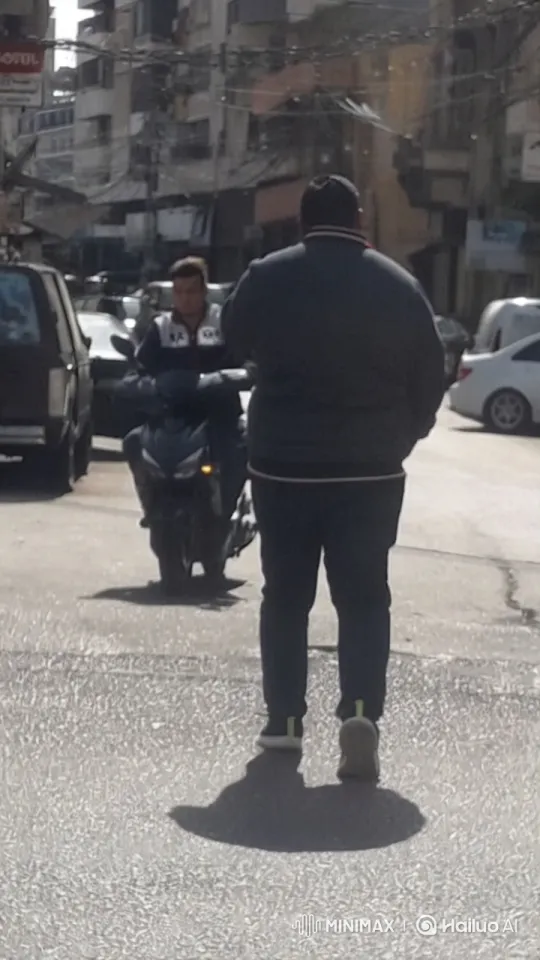 Urban Encounter: Person and Motorcyclist on Busy Street – AI Generated Video | Hailuo AI
