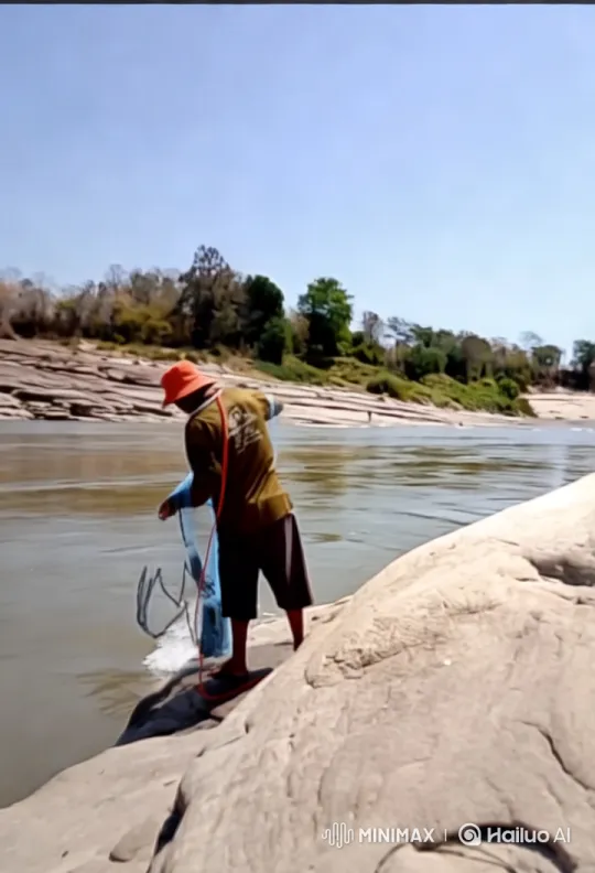 Tranquil River: Fisherman's Artful Net Casting – AI Generated Video | Hailuo AI