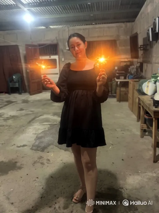 Dancer Showcases Martial Arts with Sparklers in Dim Garage – AI Generated Video | Hailuo AI