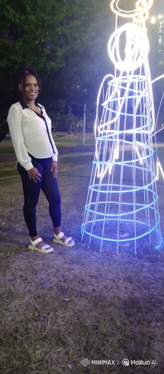 Woman Dances by Illuminated Sculpture in Night Park – AI Generated Video | Hailuo AI