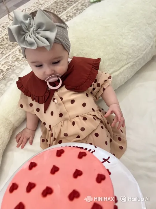 Baby's Delightful Interaction with Heart-Decorated Cake – AI Generated Video | Hailuo AI