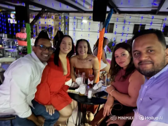 Friends Celebrating Outdoors with Drinks and Festive Lights – AI Generated Video | Hailuo AI