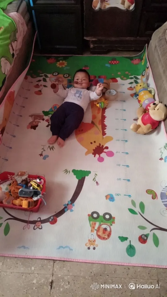 Child Joyfully Dancing on Play Mat with Toys – AI Generated Video | Hailuo AI