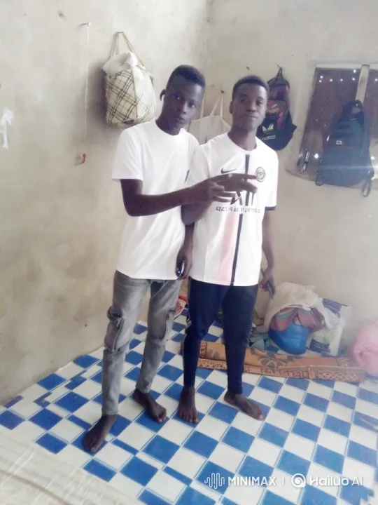 Young Men Interacting Casually in a Modest Room – AI Generated Video | Hailuo AI