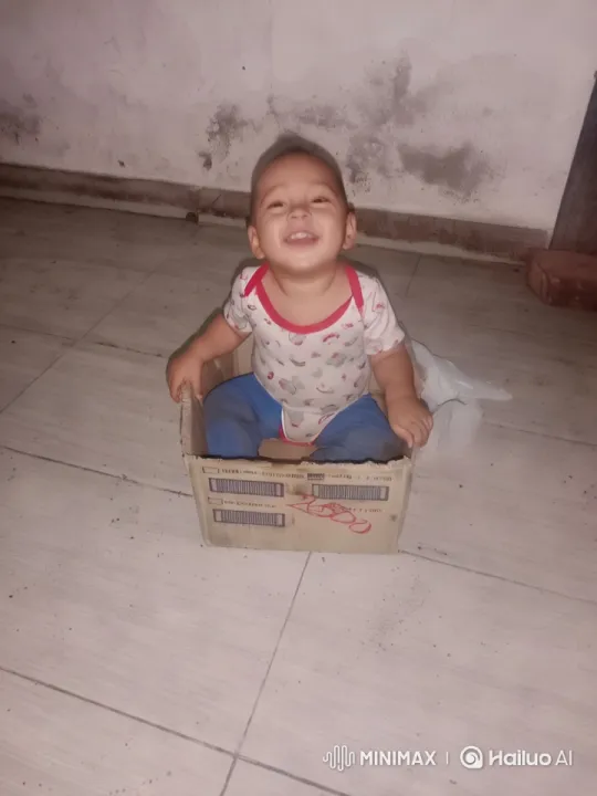 Baby in Onesie Plays in Cardboard Box – AI Generated Video | Hailuo AI