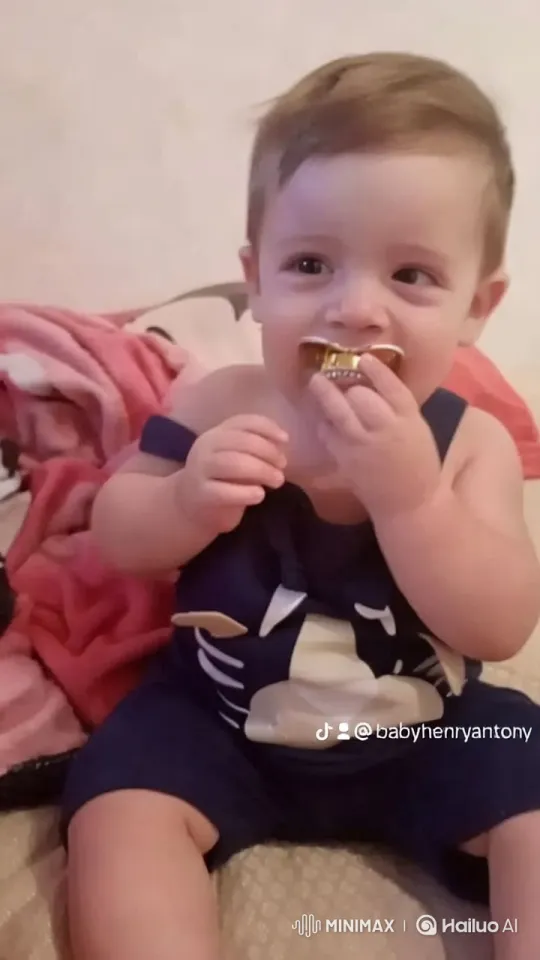 Baby Dancing Joyfully in Pink Blanket Scene – AI Generated Video | Hailuo AI
