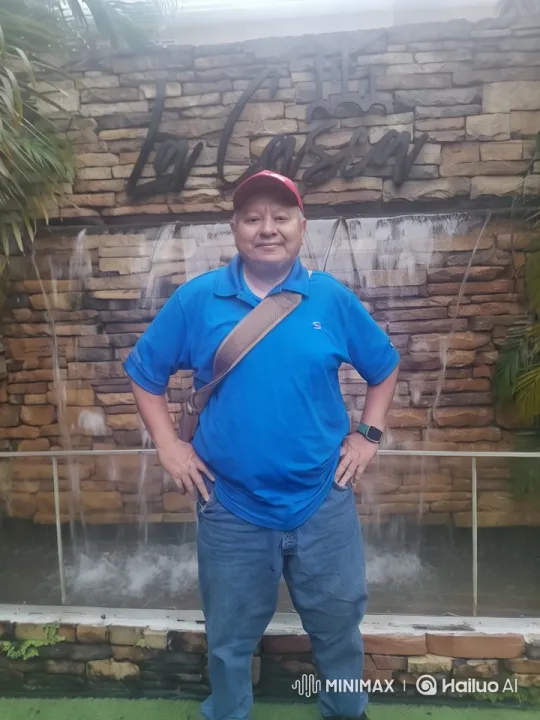 Confident Man at Tropical Waterfall – AI Generated Video | Hailuo AI