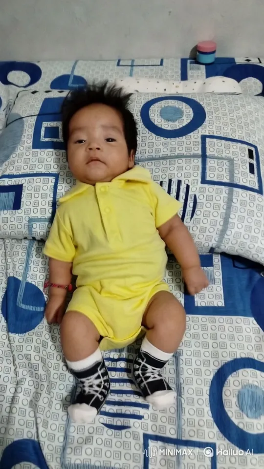 Baby's Energetic Kung Fu Play on Patterned Bed – AI Generated Video | Hailuo AI