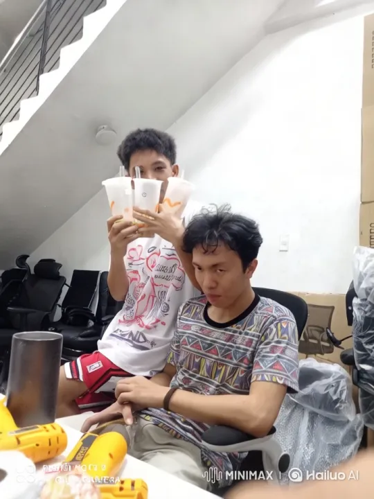 Two Friends Playfully Interact in a Colorful Room – AI Generated Video | Hailuo AI