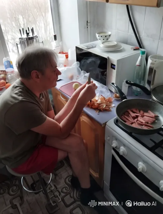 Man Preparing Meal in Snowy Kitchen – AI Generated Video | Hailuo AI
