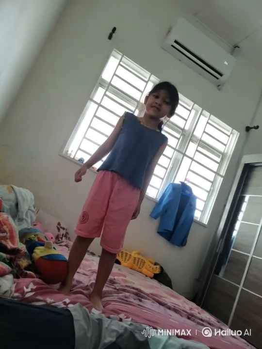 Energetic Girl Dances and Runs on Bed in Cozy Room – AI Generated Video | Hailuo AI