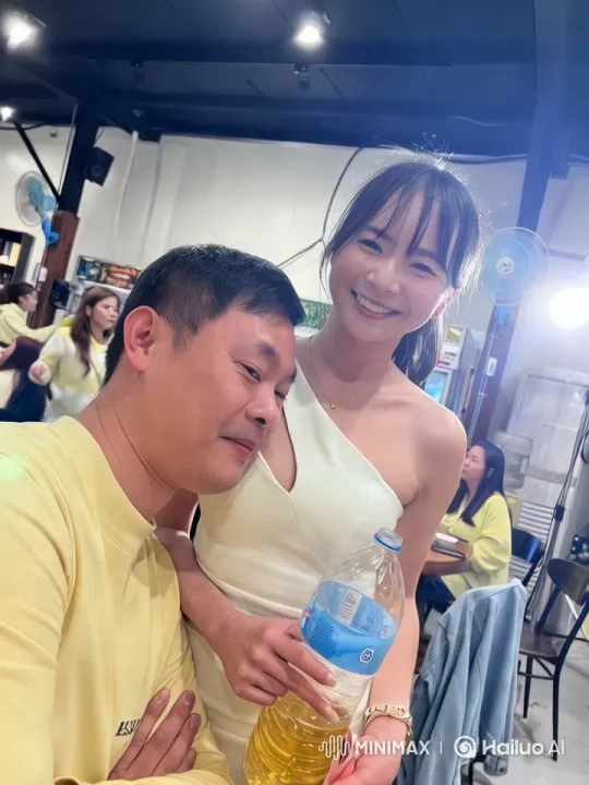 Couple Shares Intimate Moment in Lively Indoor Setting – AI Generated Video | Hailuo AI