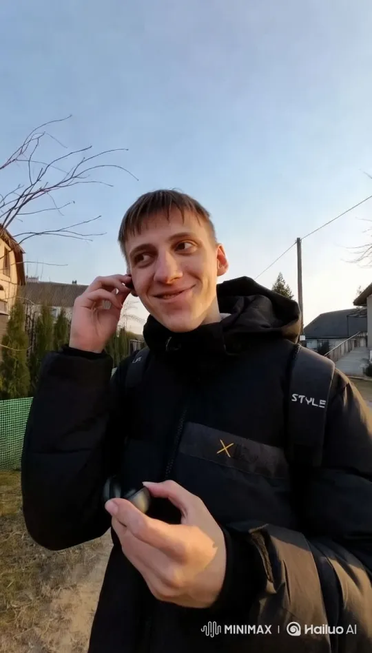 Young Man Adjusting Earbud in Serene Residential Setting – AI Generated Video | Hailuo AI