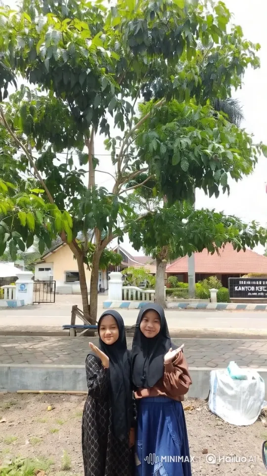 Girls in Traditional Attire by a Lush Tree – AI Generated Video | Hailuo AI