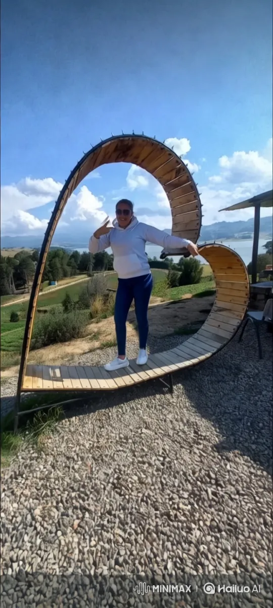 Joyful Person on Heart-Shaped Structure in Scenic Landscape – AI Generated Video | Hailuo AI