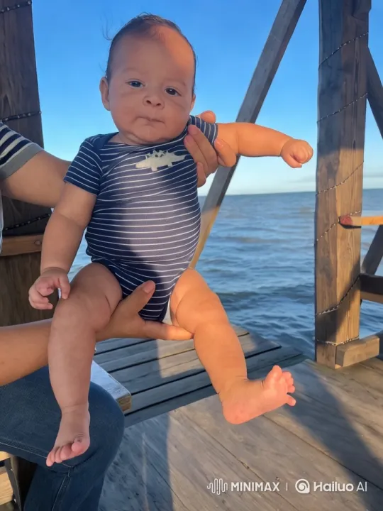 Baby Dancing Joyfully on Seaside Wooden Platform – AI Generated Video | Hailuo AI