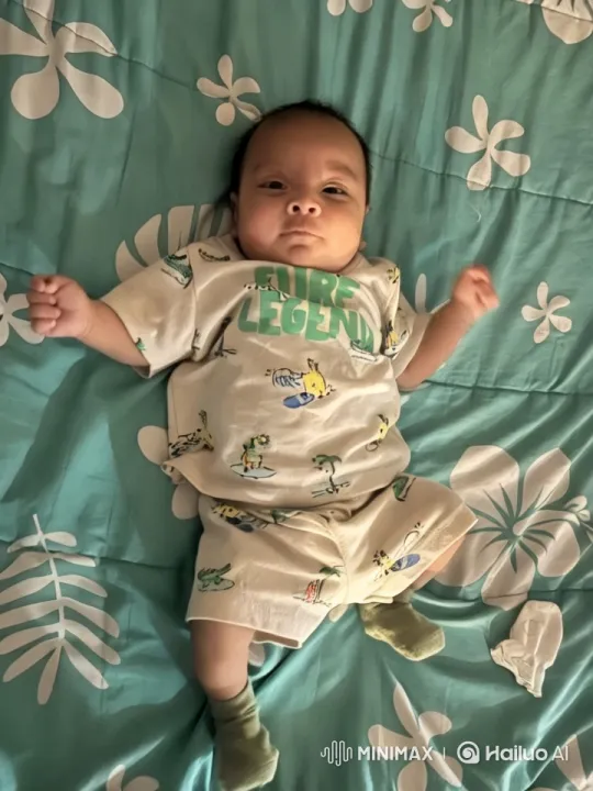 Baby's Playful Kung Fu Dance on Floral Bedspread – AI Generated Video | Hailuo AI