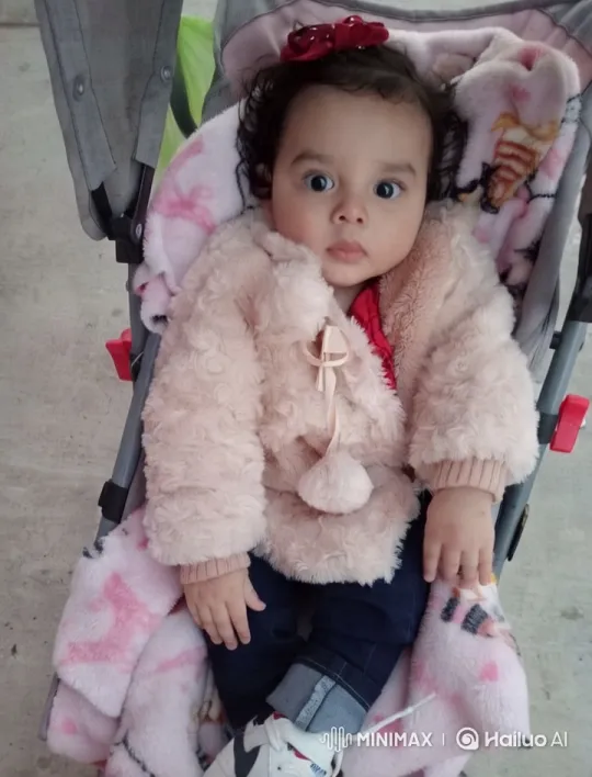 Child in Stroller Showcases Fashion and Playfulness – AI Generated Video | Hailuo AI