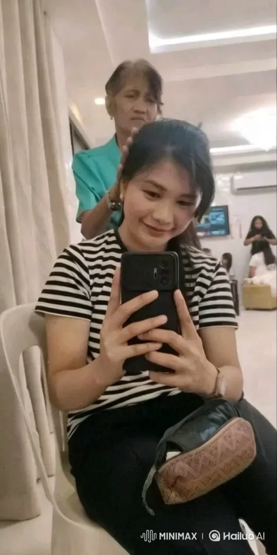 Modern Indoor Scene with Seated Individual and Hair Stylist – AI Generated Video | Hailuo AI