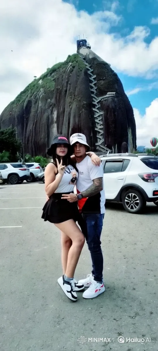 Couple's Intimate Moment Against Majestic Rock Background – AI Generated Video | Hailuo AI